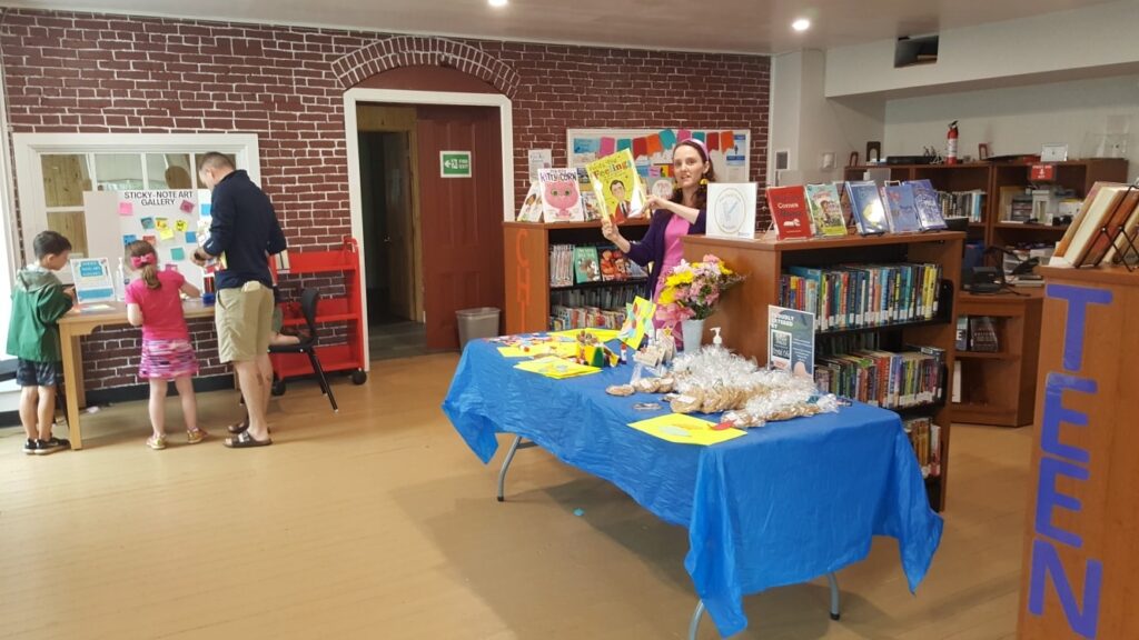 Interior of the Oxford Library, with clients and Librarian Megan McNutt