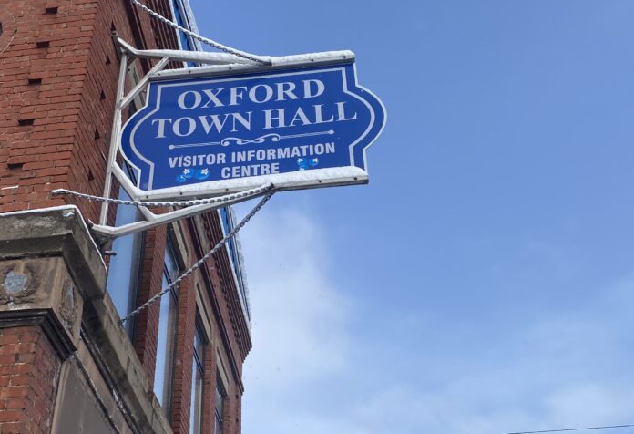 Photo of the sign hanging on the Oxford Town Hall