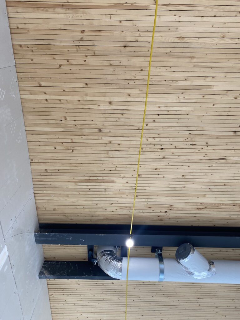 The edge-on design of 2x4 planks layered along the OCC's ceiling